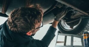 mecanics - car repair - man repairing a car