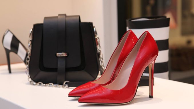 red high heels shoes with black handbag
