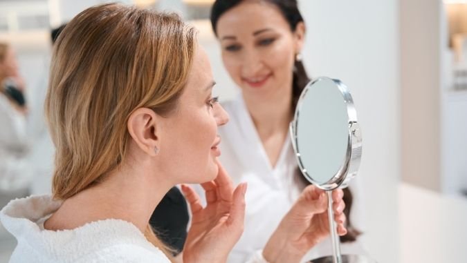 woman looking in the mirror