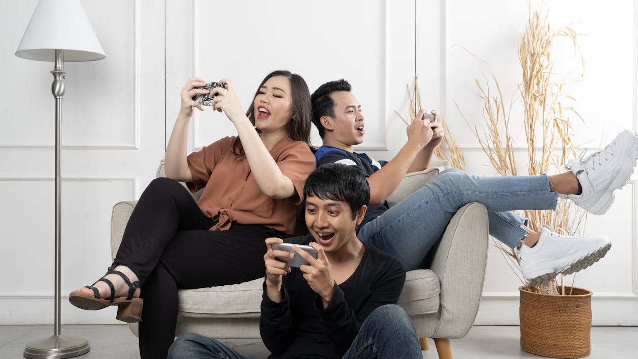 Group of friends enjoying mobile games – best entertainment apps 2025