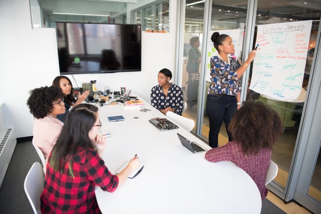 women-colleagues-gathered-inside-conference-room-
