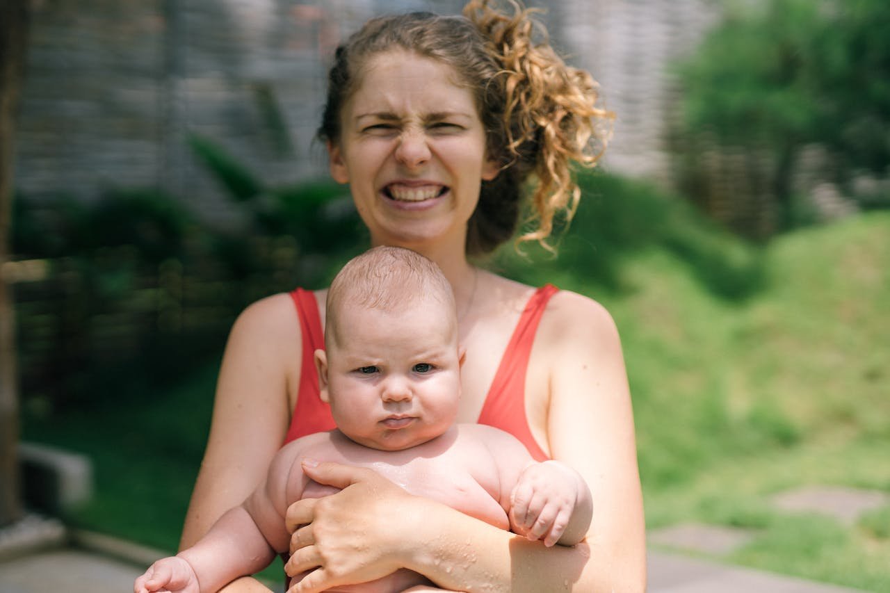 woman-carrying-baby