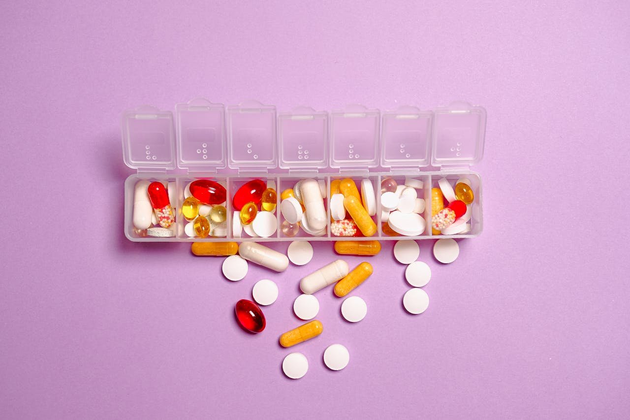 medication-pills-on-white-plastic-container-
