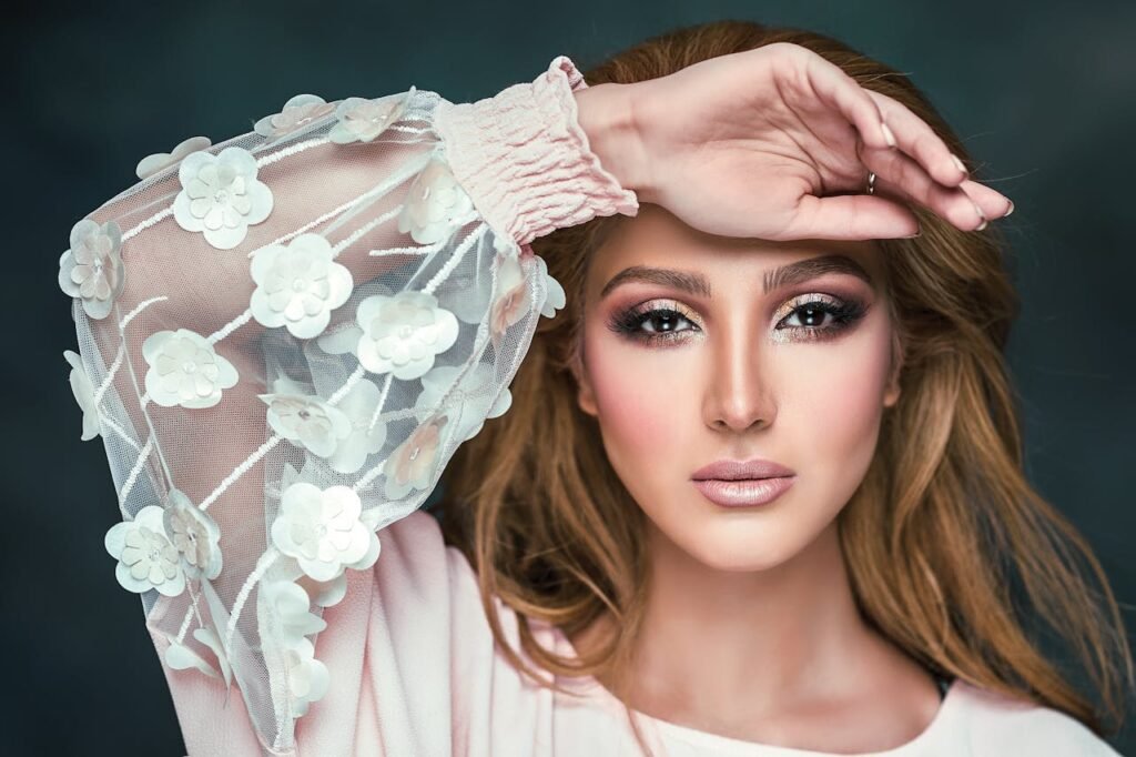 woman-wearing-floral-long-sleeved-shirt-covering-her-forehead-2823974