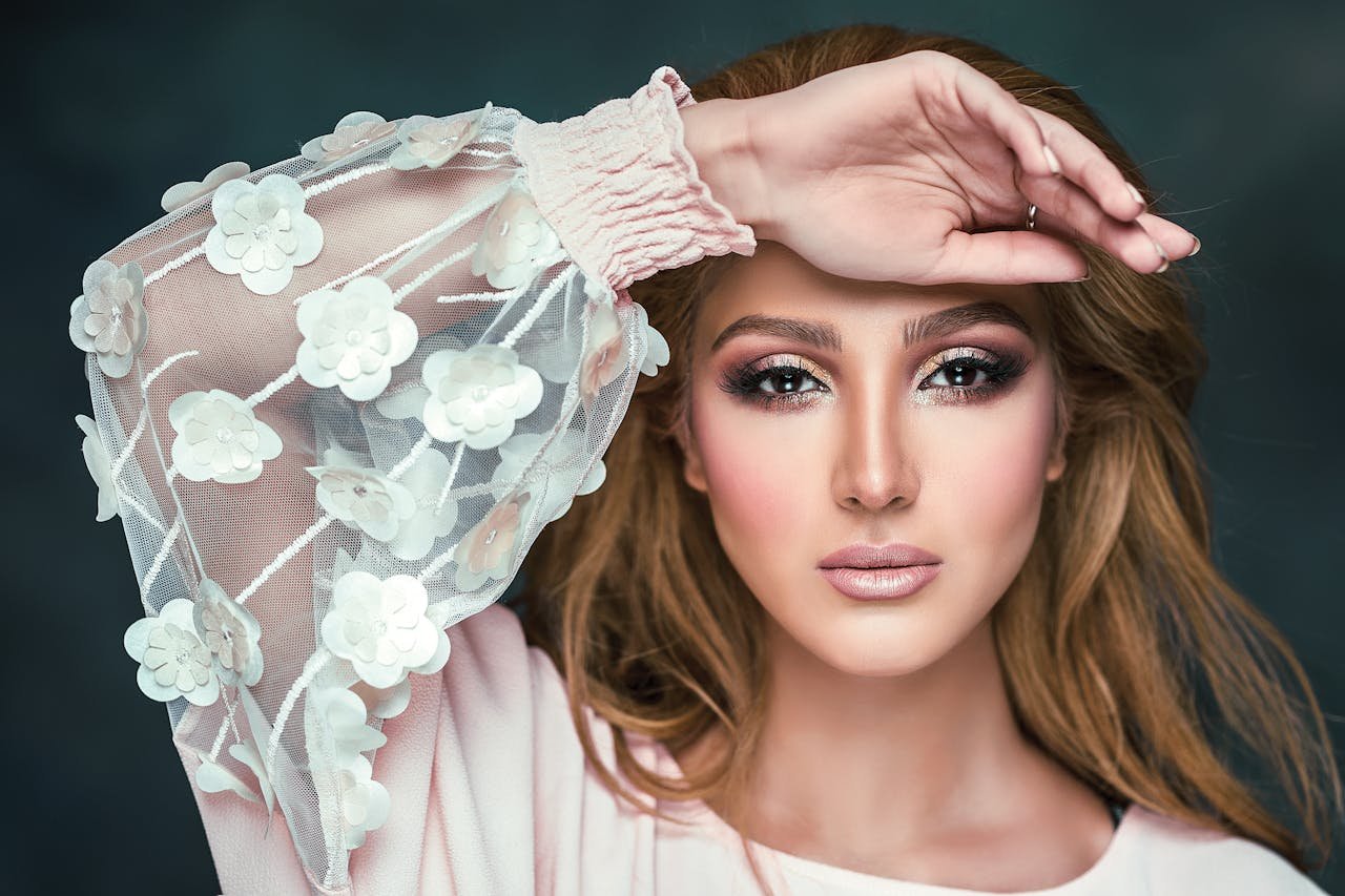 woman-wearing-floral-long-sleeved-shirt-covering-her-forehead-2823974