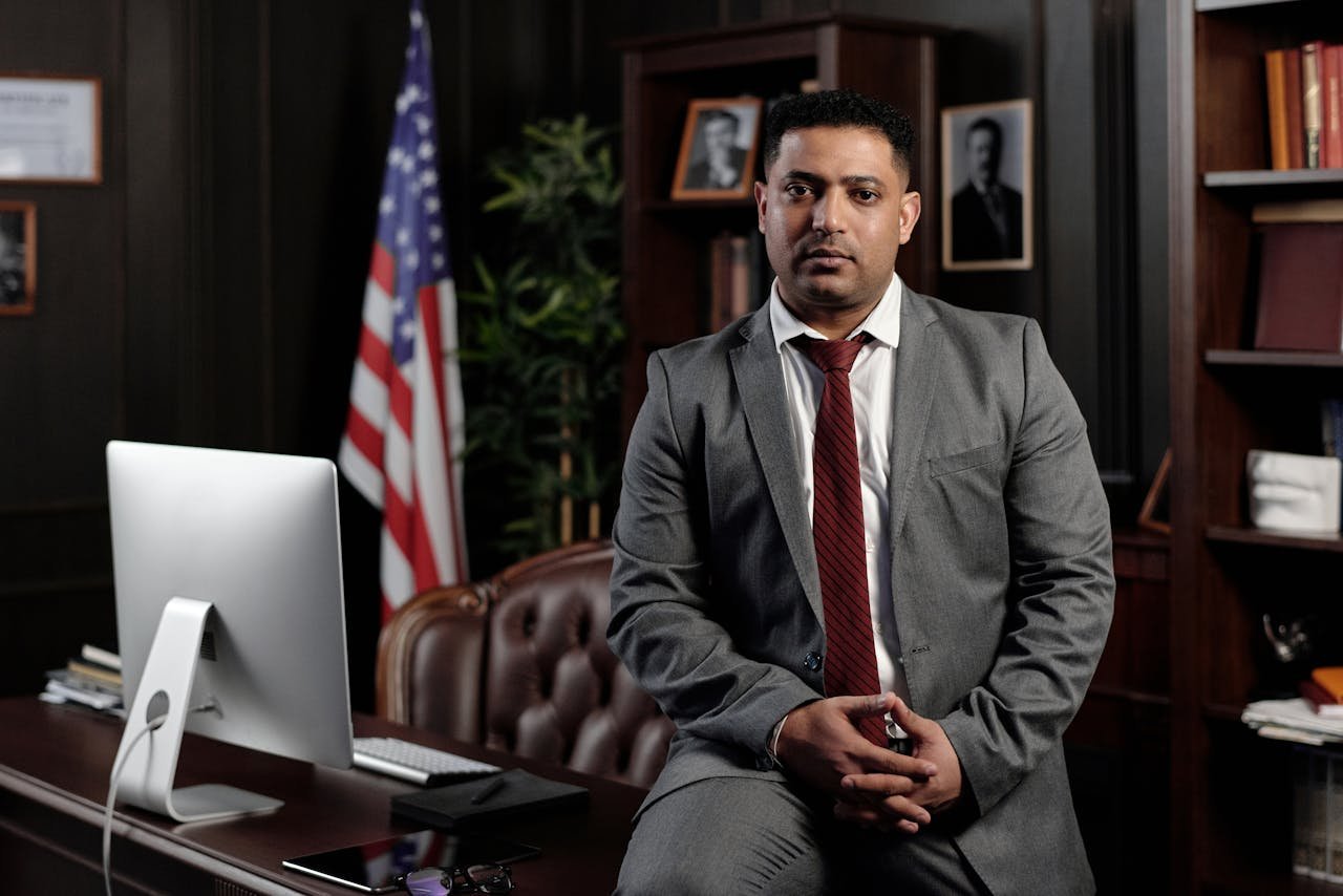 How to get a green card. Professional immigration lawyer sitting in U.S. office, ready to help with green card and visa applications