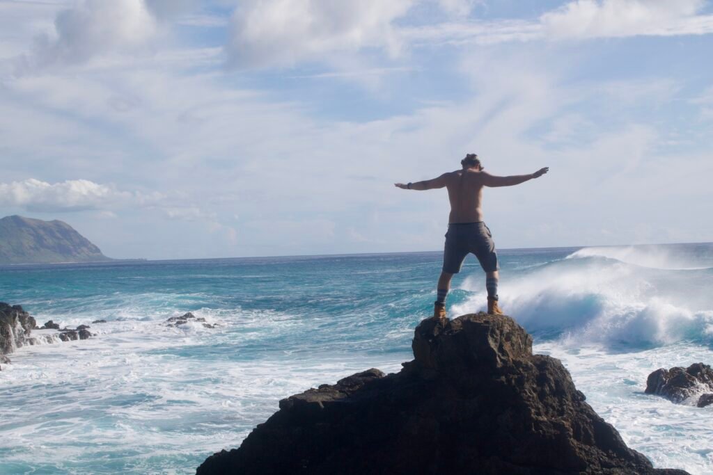 
Harrison-Monroe-Standing-Free-on-Ocean-Rocks