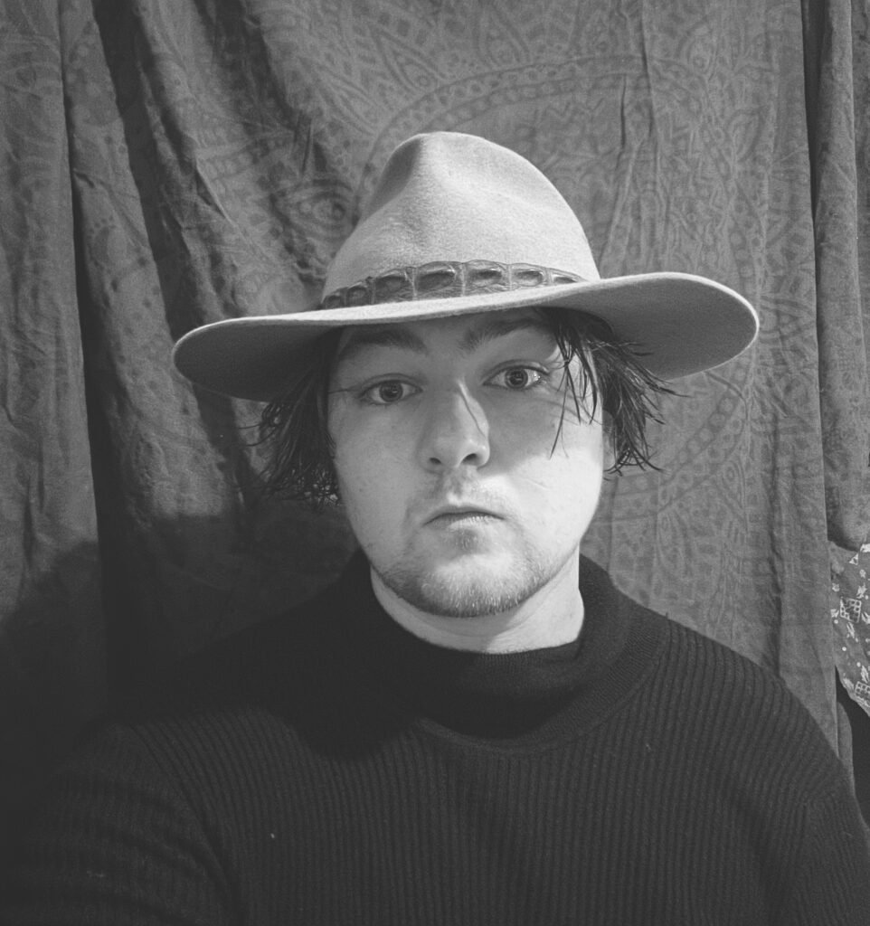 Harrison Monroe in Hat and Turtleneck – A Portrait of the Artist