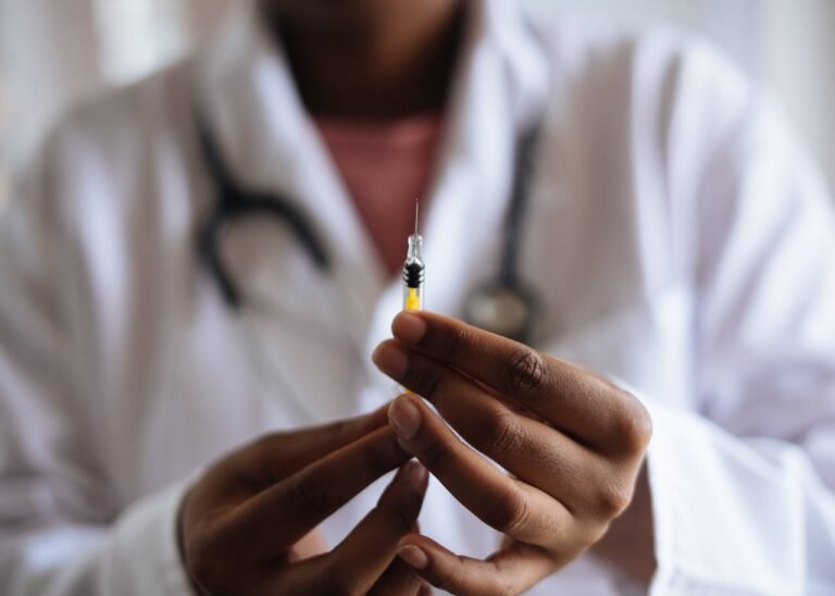 a person holding a syringe