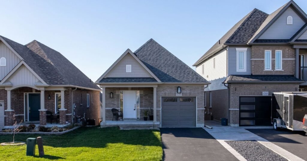 The Real Estate World gray-and-white-concrete-house