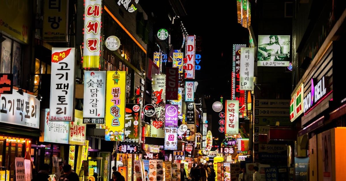 Seoul’s Myeongdong beauty district at night, a top K-Beauty travel experience in South Korea.