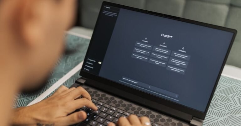 Person using ChatGPT on a laptop illustrating how AI boosts creativity and productivity in 2025 – Pump It Up Magazine