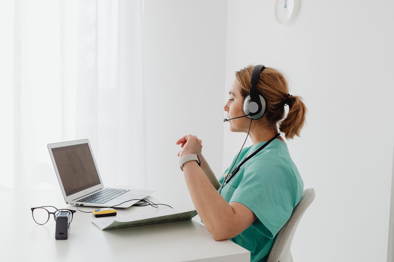 A healthcare worker using secure telemedicine technology — showcasing how medical cybersecurity safeguards patient privacy and hospital systems.