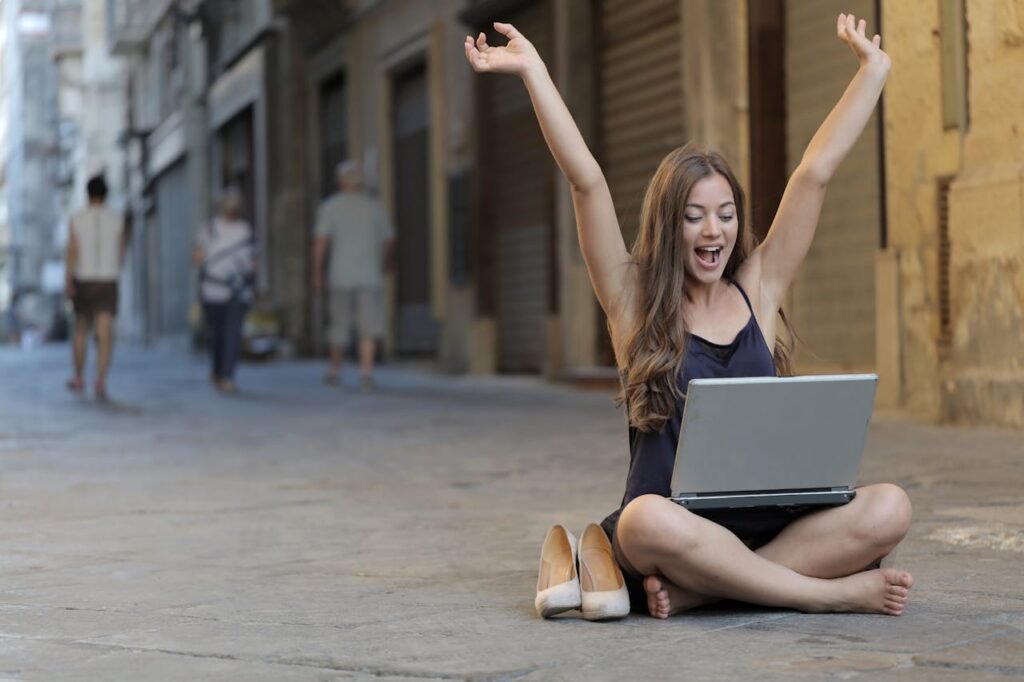 woman celebrating success habits and personal achievement with positive mindset
