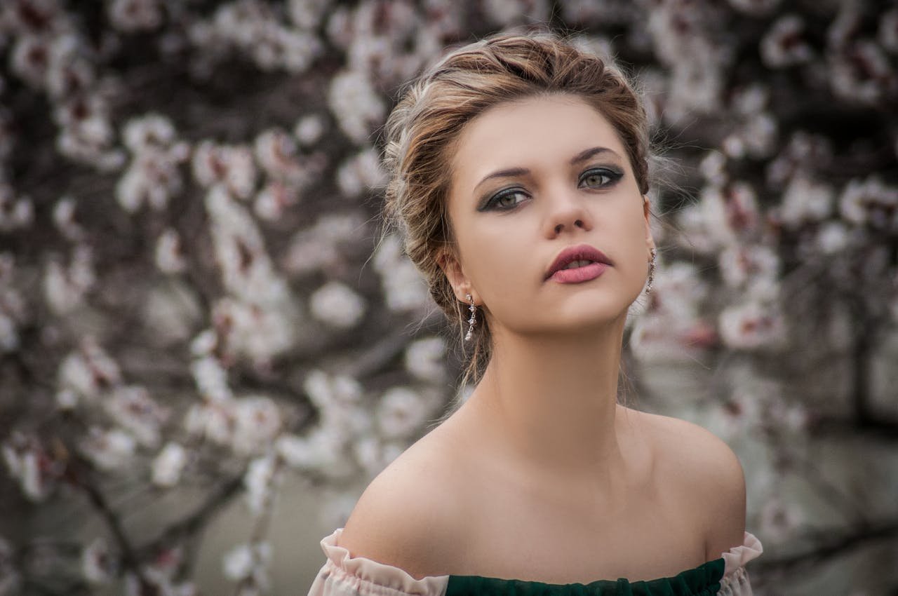 Young woman wearing TikTok-inspired viral makeup look with bold eyeliner and natural lips, trending in 2025 beauty styles.