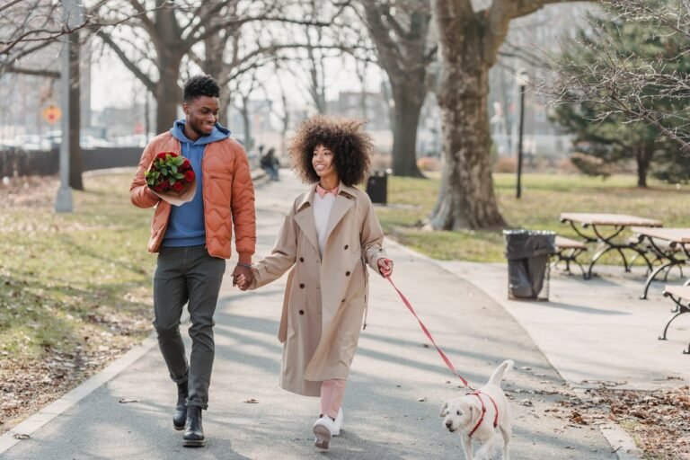 positive-black-couple-walking-in-park-with-dog-what to wear for your first date