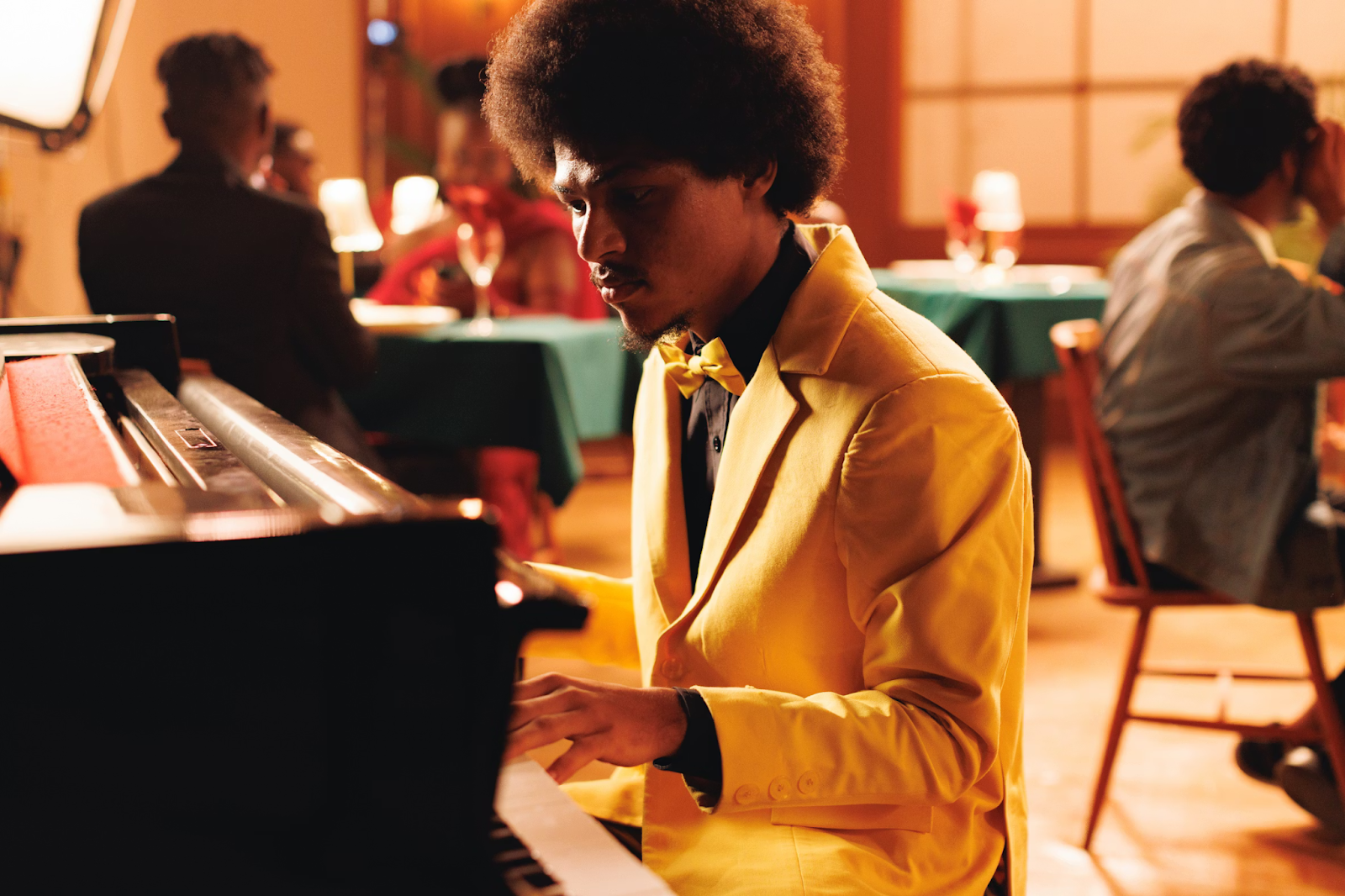 man laying the piano. Music & Your Brain