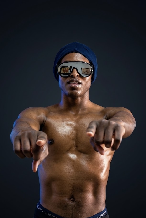 YSM shirtless portrait wearing sunglasses pointing forward with confident expression representing power and self belief