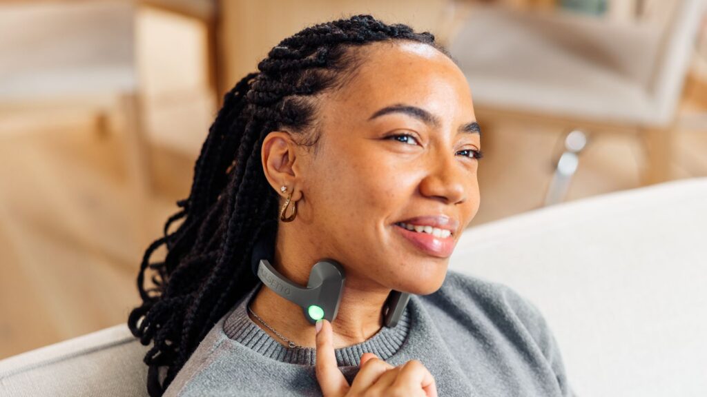 Woman using Pulsetto vagus nerve stimulation device for stress relief