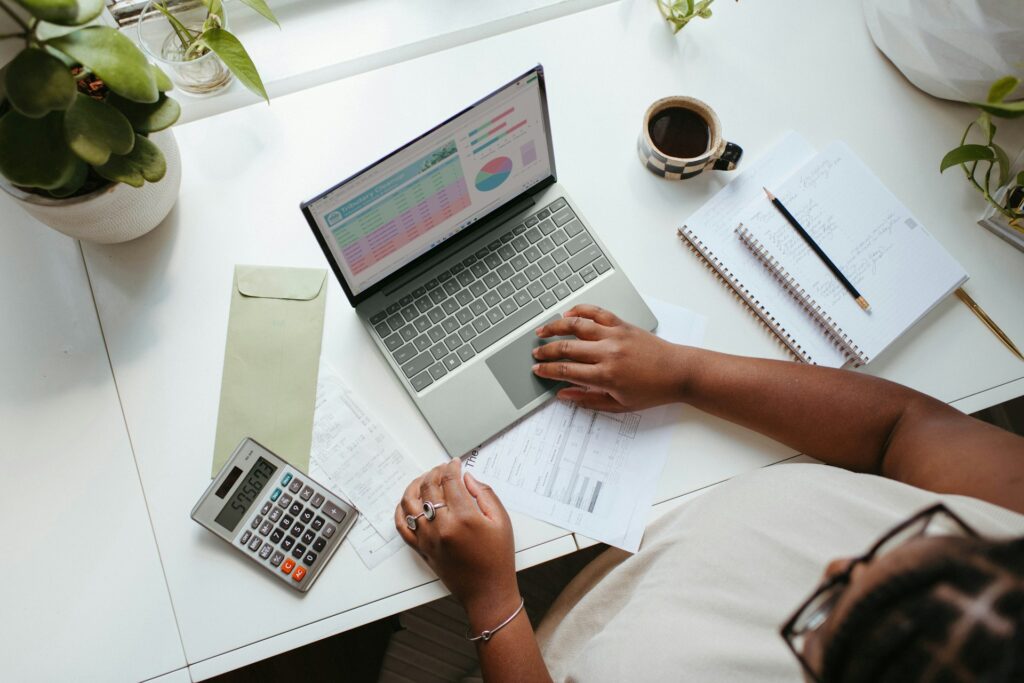 a-person-sitting-at-a-table-with-a-laptop-business-finance