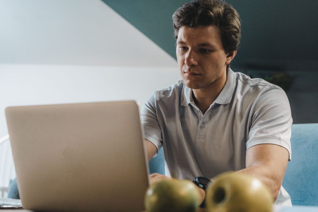 Man on computer creatin landing page