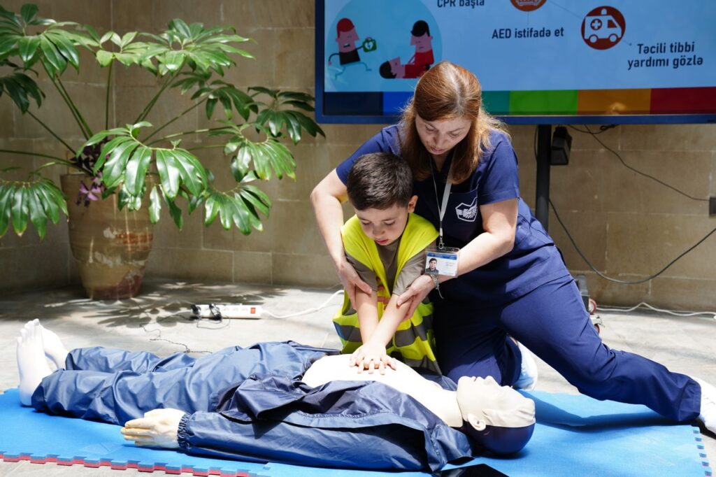 BLS TRAINING - child-and-nurse-performing-cpr-training