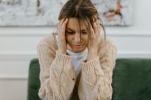 sad-woman-sitting-on-a-sofa-need self-care