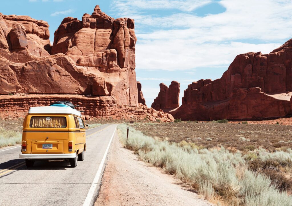 yellow volkswagen van on road trip